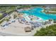 Aerial view of the Epperson Lagoon featuring beach volleyball courts and cabana seating at 31440 Barrel Wave Way, Wesley Chapel, FL 33545