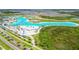 Epperson Lagoon aerial view: turquoise waters, beach volleyball, and sandy shores at 31440 Barrel Wave Way, Wesley Chapel, FL 33545