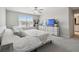 Spacious main bedroom featuring a ceiling fan, bright natural light, and comfortable decor at 31440 Barrel Wave Way, Wesley Chapel, FL 33545