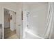 Bathroom featuring shower and bathtub combo with white tiles at 3159 Marisa Pl, Holiday, FL 34691