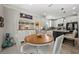 Bright dining room with a wooden table, white chairs, and a decorative hutch at 3159 Marisa Pl, Holiday, FL 34691