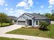 Inviting single-Gathering residence with a well-kept lawn, three-car garage, and charming curb appeal at 3159 Marisa Pl, Holiday, FL 34691