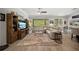 Cozy living room with ample seating, modern decor, and a seamless transition to outdoor views at 3159 Marisa Pl, Holiday, FL 34691
