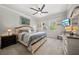 Comfortable main bedroom with a ceiling fan, bedside tables, and plenty of natural light at 3159 Marisa Pl, Holiday, FL 34691