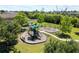 Community playground featuring modern play structures, swings, and shaded picnic areas, creating a fun outdoor area at 3159 Marisa Pl, Holiday, FL 34691