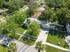 Overhead shot showcasing a home with a manicured lawn, complemented by lush trees and a neatly paved driveway at 317 N Washington Ave, Clearwater, FL 33755