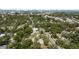 An overhead perspective capturing the harmonious blend of suburban homes and the surrounding verdant landscape at 317 N Washington Ave, Clearwater, FL 33755