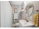 Well-lit bathroom featuring a white vanity and shower-tub combo, providing a comfortable space at 317 N Washington Ave, Clearwater, FL 33755