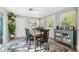 Sunlit dining room with a breakfast bar, modern decor, and access to the outdoors at 317 N Washington Ave, Clearwater, FL 33755