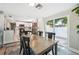 Dining area seamlessly connected to kitchen, featuring natural light and modern design elements at 317 N Washington Ave, Clearwater, FL 33755