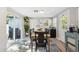 Dining area with a wood table, modern decor, and access to outdoor space at 317 N Washington Ave, Clearwater, FL 33755
