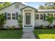 Close-up of front door, showcasing decorative wreath and manicured landscaping at 317 N Washington Ave, Clearwater, FL 33755