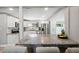An open kitchen showcasing granite countertops, stainless steel appliances, and a breakfast bar area at 317 N Washington Ave, Clearwater, FL 33755