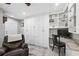 Versatile living space with custom built-ins, desk area, and a comfortable recliner at 317 N Washington Ave, Clearwater, FL 33755