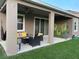 Inviting covered back porch with comfortable seating, perfect for relaxing and enjoying the outdoor space at 33034 Sand Creek Dr, Wesley Chapel, FL 33543