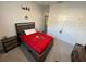 Bedroom featuring Buccaneers themed bedding and white wall with sports decorations at 33034 Sand Creek Dr, Wesley Chapel, FL 33543