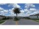 Community entrance with landscaping and gate ensuring privacy, safety, and a beautiful welcome at 33034 Sand Creek Dr, Wesley Chapel, FL 33543