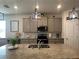 Kitchen with a large island, granite counters, and stainless steel appliances at 33034 Sand Creek Dr, Wesley Chapel, FL 33543