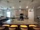 Kitchen featuring island with bar seating, granite counters and stainless steel appliances at 33034 Sand Creek Dr, Wesley Chapel, FL 33543