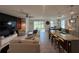 Open concept living space combines living room and kitchen for modern living at 33034 Sand Creek Dr, Wesley Chapel, FL 33543