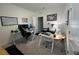Spacious home office featuring dual desks, neutral colors, and a comfortable seating area at 33034 Sand Creek Dr, Wesley Chapel, FL 33543