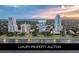 Stunning aerial view of a luxury condo building near the water at sunset at 3435 Bayshore Blvd # 2100P, Tampa, FL 33629