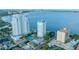 Aerial view featuring high rise buildings with amenities like a tennis court and swimming pool near the bay at 3435 Bayshore Blvd # 2100P, Tampa, FL 33629
