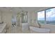 Modern bathroom with a freestanding tub, glass-enclosed shower, and scenic views at 3435 Bayshore Blvd # 2100P, Tampa, FL 33629