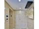 Hallway featuring wood paneling, modern lighting, and apartment number 21 at 3435 Bayshore Blvd # 2100P, Tampa, FL 33629