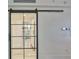 Hallway featuring a steel and glass partition door with a view to an open concept area at 3435 Bayshore Blvd # 2100P, Tampa, FL 33629