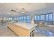 Modern, open kitchen with a large island, sleek cabinetry, and panoramic views of the waterfront at 3435 Bayshore Blvd # 2100P, Tampa, FL 33629