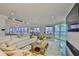Spacious living room with water views, a modern entertainment center, and comfortable seating arrangement at 3435 Bayshore Blvd # 2100P, Tampa, FL 33629