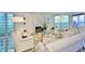 Bright living room with plush seating, fireplace, and expansive windows offering stunning water views at 3435 Bayshore Blvd # 2100P, Tampa, FL 33629