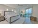 Serene main bedroom featuring a plush bed, sitting area, and balcony access at 3435 Bayshore Blvd # 2100P, Tampa, FL 33629