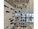 Stunning wine cellar with a modern glass enclosure and unique floating bottle display at 3435 Bayshore Blvd # 2100P, Tampa, FL 33629