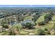 Beautiful aerial shot of the picturesque golf course featuring a winding pond and manicured greens at 36750 Us 19 N # 24-104, Palm Harbor, FL 34684