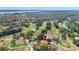 Scenic aerial view of the well-manicured golf course with mature trees and tranquil water features at 36750 Us 19 N # 24-104, Palm Harbor, FL 34684