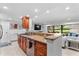 Open kitchen area with granite counters, stainless appliances, and easy access to living area at 36750 Us 19 N # 24-104, Palm Harbor, FL 34684