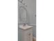 Bathroom with a white sink vanity and mosaic-framed mirror at 3751 Pompano Se Dr # 3751, St Petersburg, FL 33705
