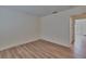 A clean, cozy bedroom with modern light-colored, faux-wood floors and fresh, neutral walls at 3751 Pompano Se Dr # 3751, St Petersburg, FL 33705