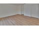A simple, bright bedroom with light-colored faux-wood floors and a large closet at 3751 Pompano Se Dr # 3751, St Petersburg, FL 33705