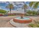 Clubhouse entrance with a water fountain and palm trees, creating a welcoming and attractive community center at 3751 Pompano Se Dr # 3751, St Petersburg, FL 33705