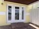 View of a charming entrance with glass doors and a brick paver porch at 3751 Pompano Se Dr # 3751, St Petersburg, FL 33705