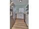 Galley kitchen featuring stainless steel appliances, white cabinetry, and stylish subway tile backsplash at 3751 Pompano Se Dr # 3751, St Petersburg, FL 33705