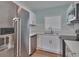 Modern kitchen featuring stainless steel appliances, white cabinetry, and a bright and clean design at 3751 Pompano Se Dr # 3751, St Petersburg, FL 33705
