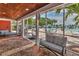 Relaxing lanai with views of the pool and tropical landscape and cushioned seating at 3751 Pompano Se Dr # 3751, St Petersburg, FL 33705