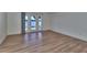 Inviting living room area with modern flooring and French doors that bring in natural light at 3751 Pompano Se Dr # 3751, St Petersburg, FL 33705