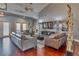Living room area with comfortable couches, large TV, and ceiling fans at 3751 Pompano Se Dr # 3751, St Petersburg, FL 33705