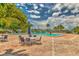 Beautiful community pool with brick patio, table seating, palm trees, and clear blue skies at 3751 Pompano Se Dr # 3751, St Petersburg, FL 33705