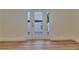 Bright room with wood floors and a glass door to a balcony with a water view at 3751 Pompano Se Dr # 3751, St Petersburg, FL 33705